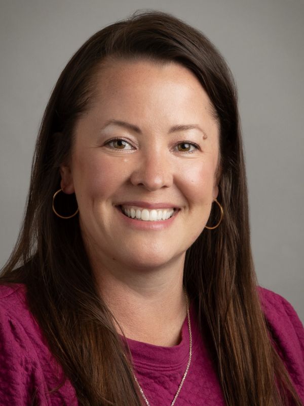 Tammy Rich is a Caucasian woman with brown hair and brown eyes. She has a welcoming smile.