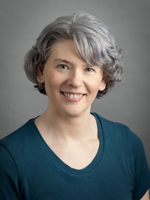 Julia Buchkina, M.D. at Upstream Functional Medicine, is a Caucasian woman with short blonde hair and blue eyes.